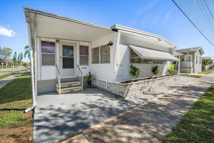 Entrance to home via Sunroom  (has central AC & heating)