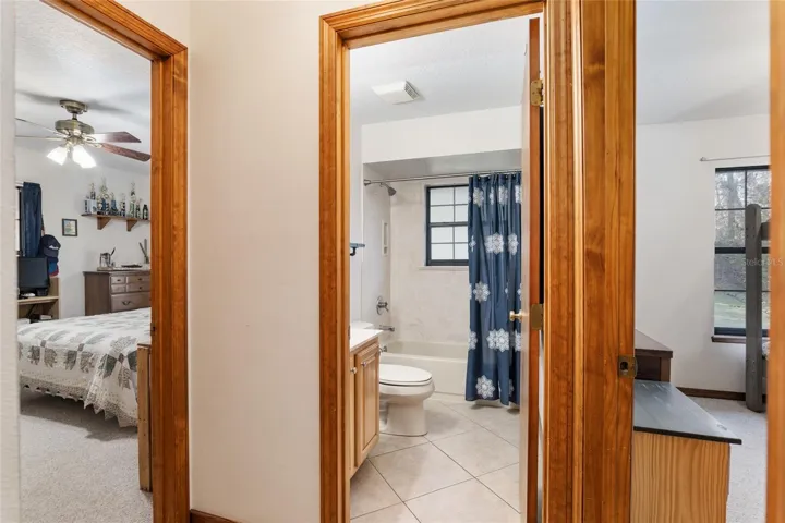 Guest bathroom between guest bedrooms