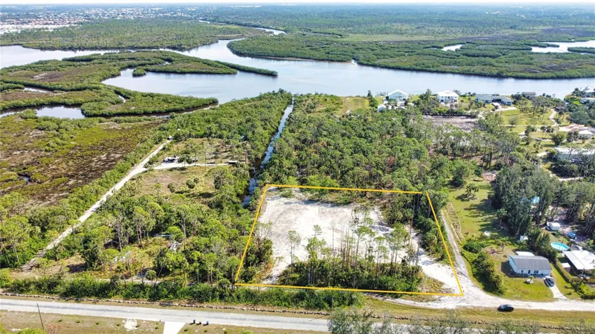2 acre cleared and filled parcel ready to build. Clean environmental study. Well dug. Looking east to Myakka River