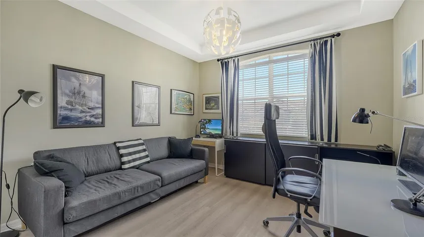 Guest Bedroom with Tray Ceiling & Vinyl Flooring