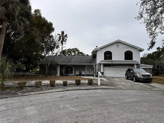4/2/2 residence is on a cul-de-sac on 0.374 acres with a pool and pond.  (NOTE: Vehicle does not convey).