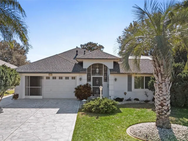 This home accentuates the Florida lifestyle with its many palm trees and large "open air" spaces in the private courtyard.