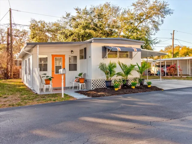 Front of Home With Florida Lanscaping and Parking for Three Vehicles 3