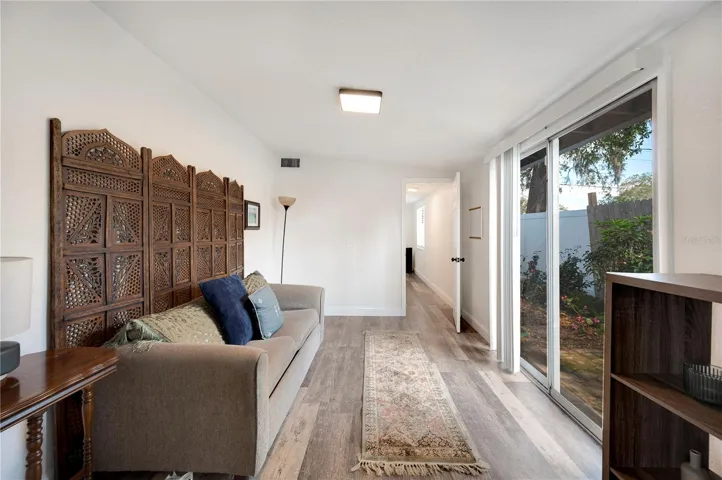 A perfect home office , along with a garden view and sliding glass doors to the rear yard.