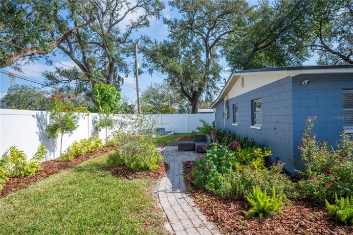 The rear of the home has a great patio , perfect for entertaining!