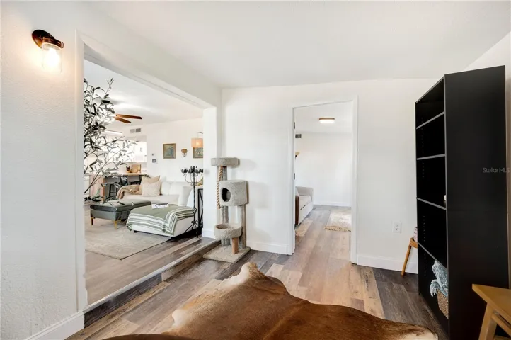 From the flex space into the main living area and the entrance in to the office and bedroom #4