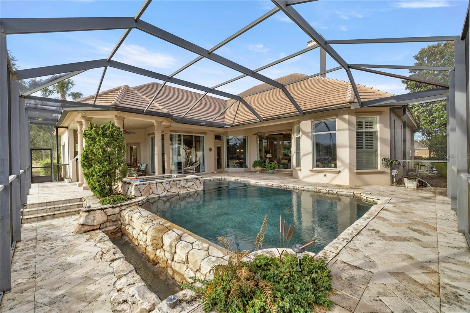 Enclosed infinity pool and outdoor kitchen