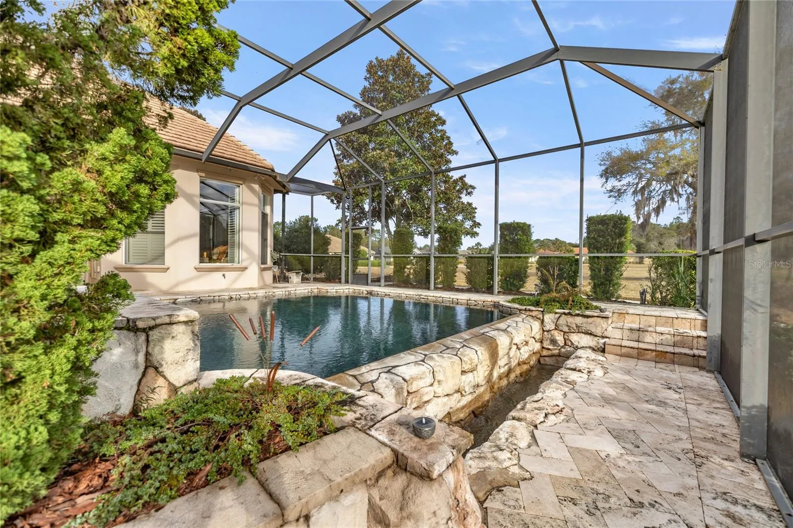 Enclosed infinity pool and outdoor kitchen