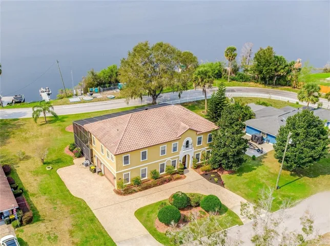 Welcome to your LAKEFRONT paradise on Clermont’s Lake Winona and this gorgeous Mediterranean style POOL HOME with a spacious floor plan sure to impress with formal, family and flex spaces, a chef’s dream GOURTMET KITCHEN, beautiful HARDWOOD FLOORS, a backyard made for entertaining, PRIVATE FLOATING DOCK, and NO HOA - bring your boat or RV!