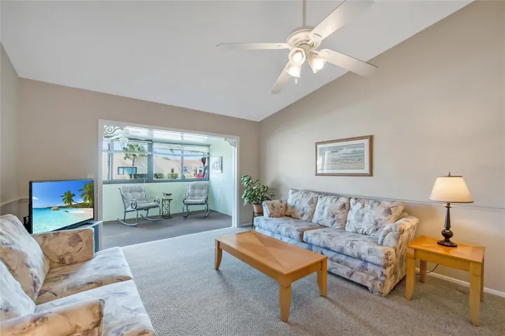 A spacious enclosed Florida room is just off the living room