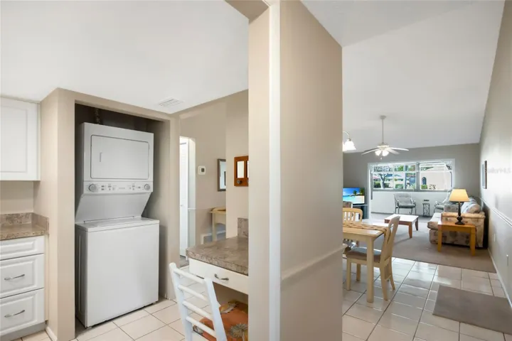 A stack washer and dryer is conveniently located in the kitchen