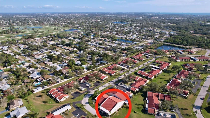 Aerial view of the unit showing the Bradenton Country Club golf course in the distance which is close by