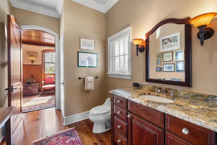 1/2 bath on main level attached to office with entrance off foyer