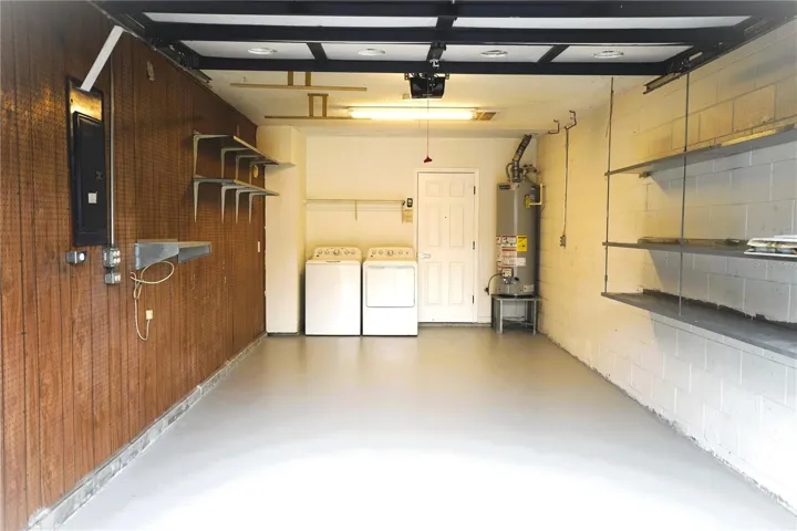 Garage with washer& dryer and gas water heater