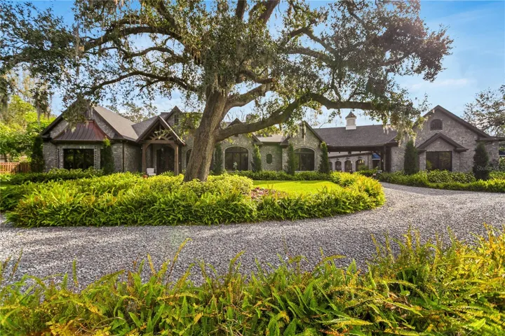Nestled beneath the gentle embrace of ancient oaks, this captivating estate greets you with its timeless façade and exquisitely manicured gardens.
