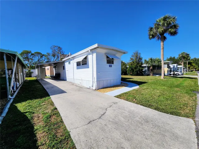 long driveway and a carport