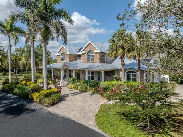 Front view of the main house featuring a circular driveway.