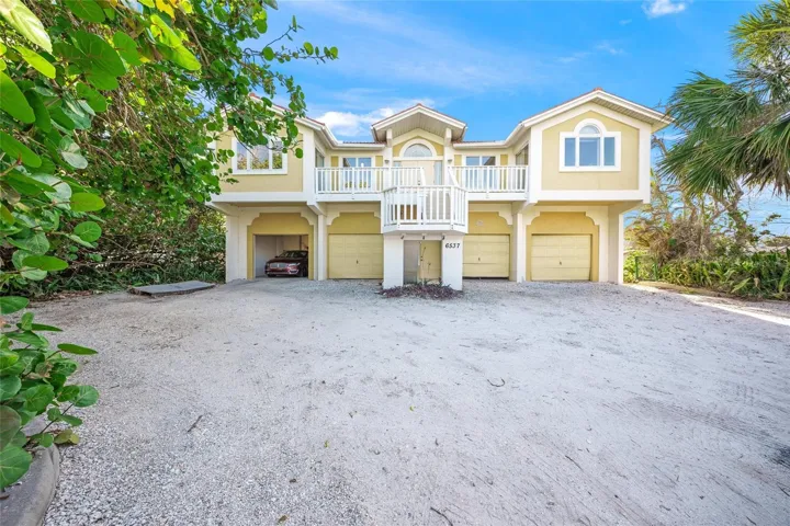 Block up and down elevated home with 8 car garage.