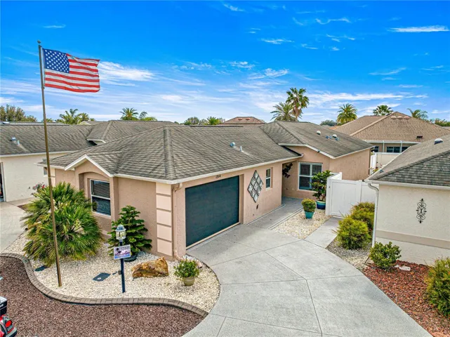 EXTERIOR FRONT PIC W/ FLAGPOLE, STONEWORK, GARAGE SCREEN !