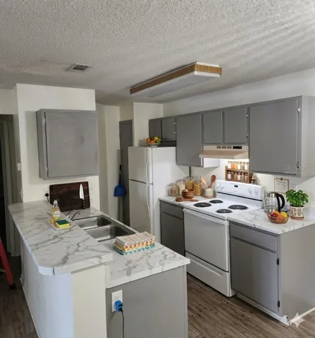 *virtually staged* *new cabinet doors were created and placed in Jan 2026. image was altered to remove construction items on the counter.