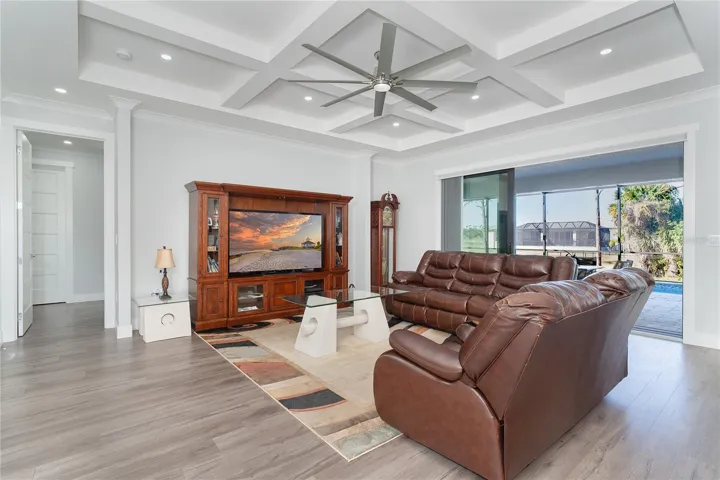 Spacious living room with sliders to the pool area