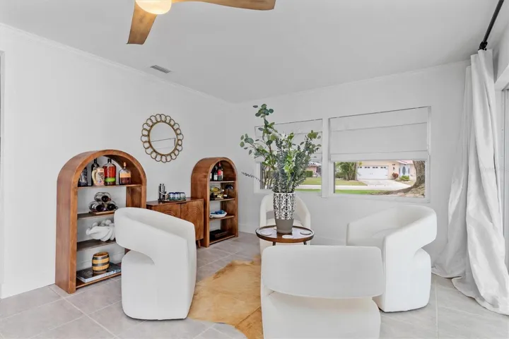 Family room with slider access to pool and screened lanai