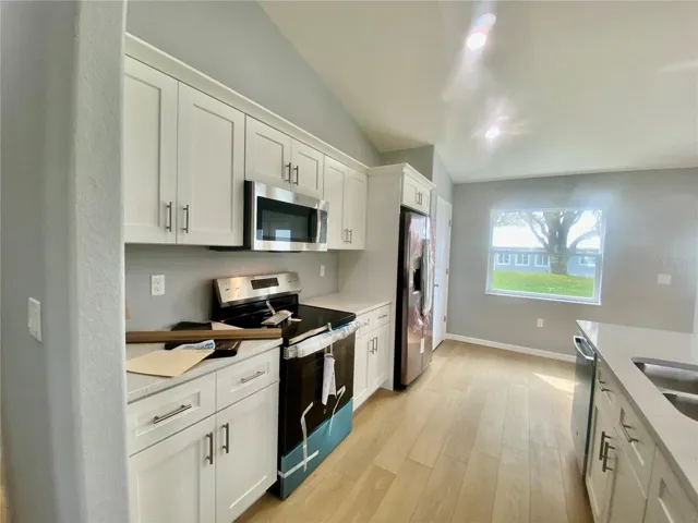 kitchen with crown molding on cabinets