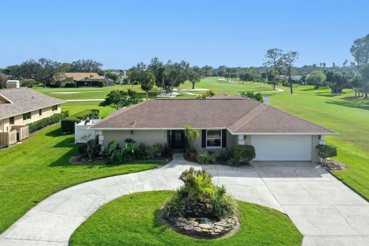 Exterior Front of Home with a spacious circular driveway greeting you!