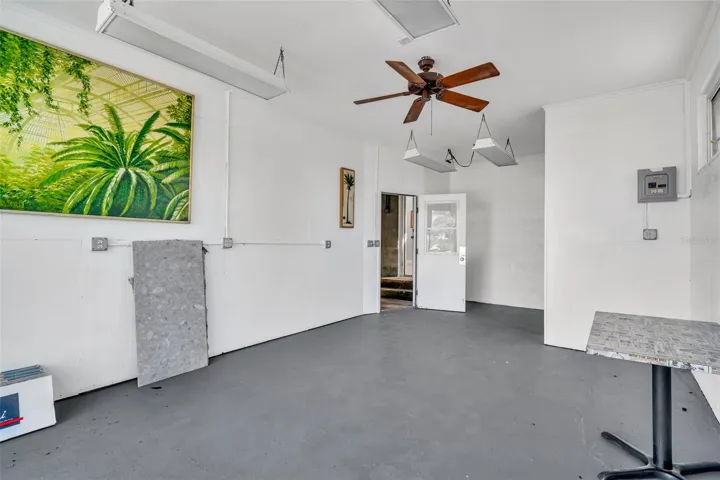Workshop open to 2 car garage