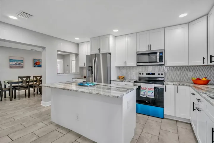 Kitchen overlooking Dining room with pass thru