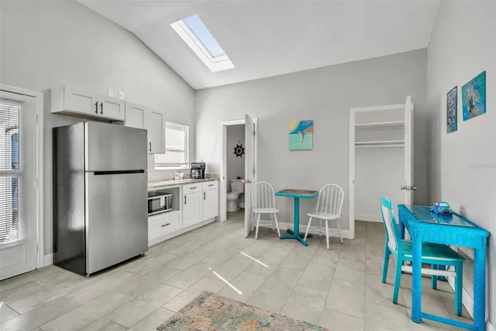 In law kitchen with refrigerator and microwave