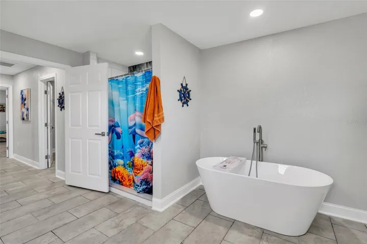 Primary bathroom with shower and tub