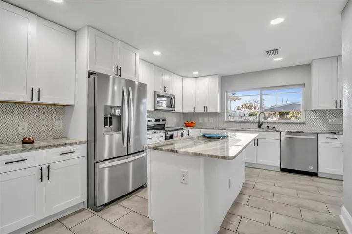Kitchen with 42 inch cabinets soft close and granite countertops. New appliances.