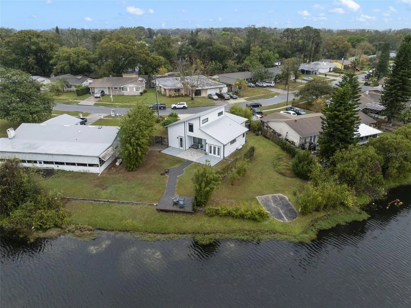 Unique opportunity to own a LAKEFRONT HOME with a MODERN/INDUSTRIAL TWIST, light and bright open concept living, high ceilings, a chef’s kitchen, ENERGY EFFICIENT & SMART HOME FEATURES, all with NO HOA in a great central location!