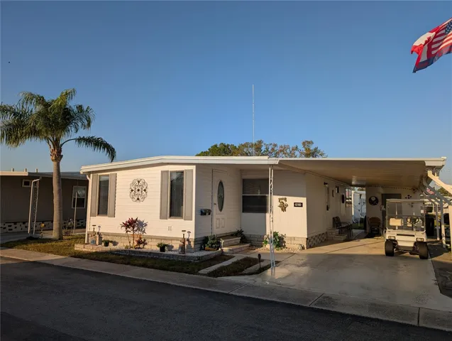 Great budget-friendly Florida home for year-round or seasonal living...1971 Elcona 24'X31' (with 10'x15' addition) furnished 2BR/1.5BA with spacious carport. Florida room addition provides 150 sq ft of additional living space.