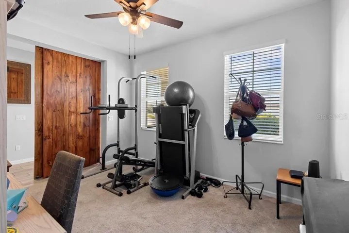 Natural light and custom barn doors for added privacy. Could use this spacious room for a  formal dinning, office, media or any idea with all  possibilities up to you.