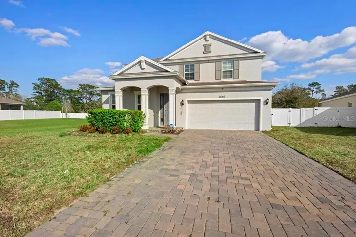 Lovely paved driveway. Front porch entrance with grand entrance. No side neighbors to left. Large open and private.