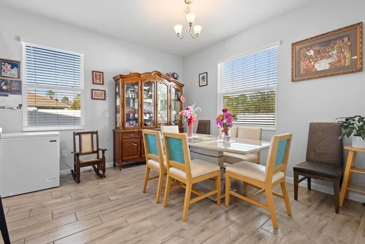 Dinning area with natural light along with Space for large table and multiple chairs.