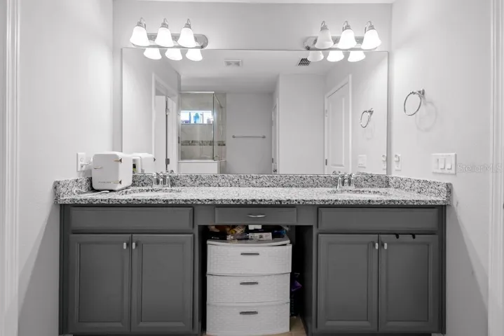 Double sink vanity wotj hd lighting.