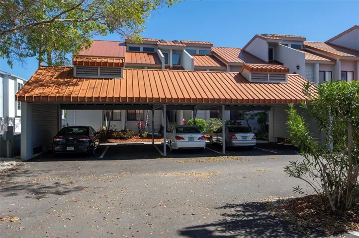 1 covered Parking, far left. 1 uncovered in shady tree area. Lots of other guest parking.