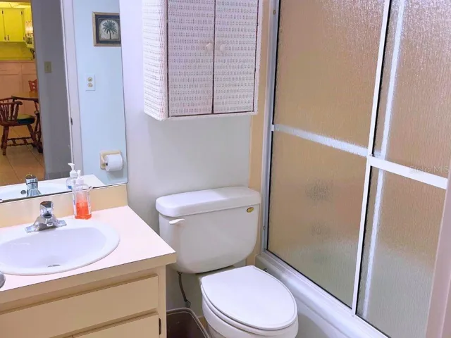 GuestBath_3006CaringWay_PortCharlotte_LightWoodCabinetry.jpg
