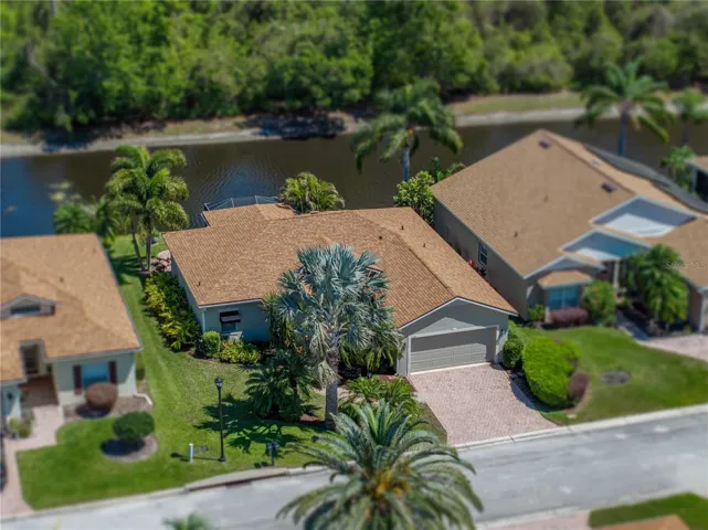 This well maintained snowbird owned DEVON is located on a pond frontage lot with a nature preserve view.
