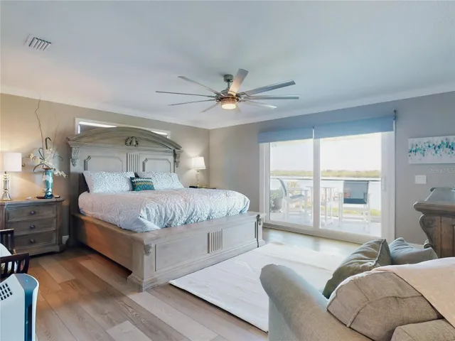 Primary Bedroom with Riverfront Balcony