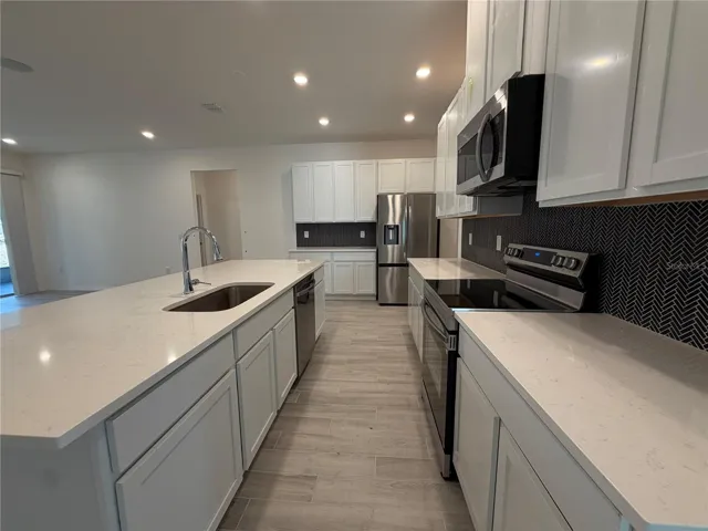 Large Island, Quartz Countertops & Stainless Appliances