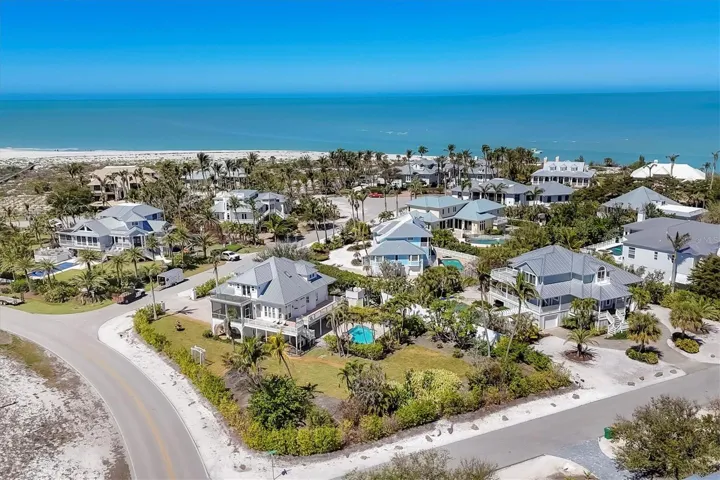 16251 Sunset Pines Circle is over half an acre of land on a private, corner lot with direct lake views and beach access!