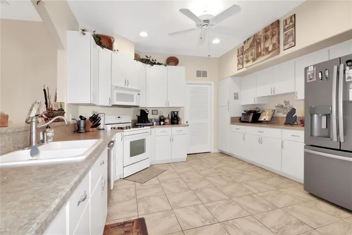 lots of cabinets and a newer refrigerator