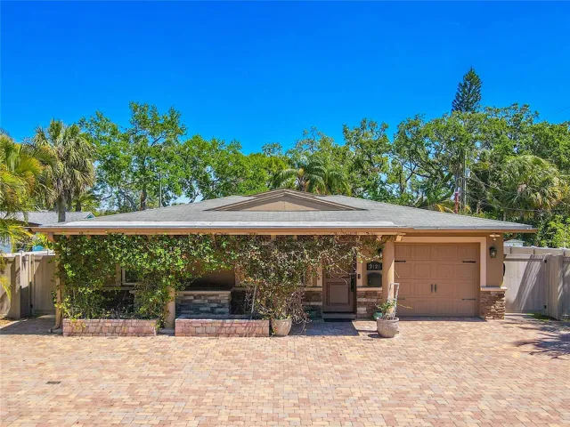 4 bedroom, 4 Bath home, Bonus Room with Putting Green located in desirable Jungle Terrace.