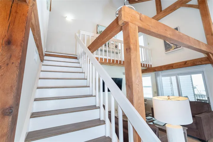 Stairs to Second Floor and Primary Bedroom and Bath.