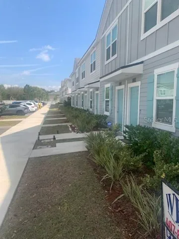 Exterior of Building.  Front view of Townhome & Sidewalk.