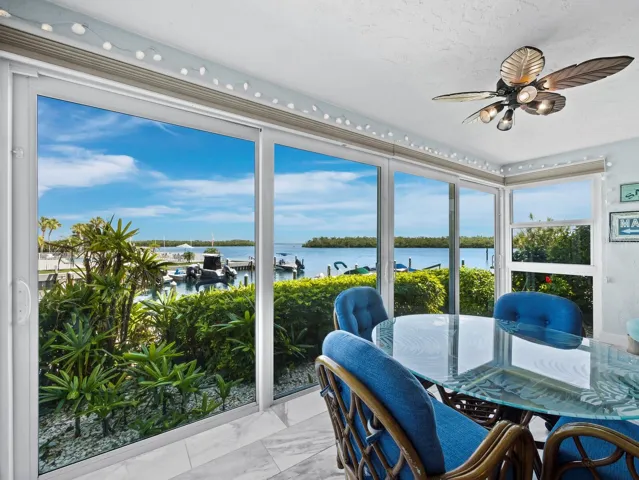 The ground floor location gives you the opportunity to step right out your high impact sliders for your morning walk with your dog along the water, to your boat at the marina or just across the way to the pool.